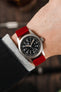 Hamilton khaki field watch fitted with Hirsch Osiris red leather watch strap worn on wrist
