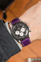purple watch strap (on wrist)