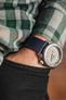 Bonetto Cinturini 270 Navy Blue and Seiko 5 Sports SRPG61K1 cement dial on wrist with hand in pocket