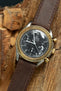 Omega Speedmaster gold bezel black dial fitted with Di Modell Natural watch strap in Brown